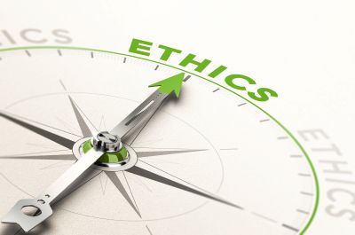 Compass with a green needle pointing toward the word “Ethics,” symbolizing ethical guidance and professional responsibility.