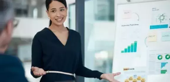 Finance professionals attending an accounting conference led by an industry expert.