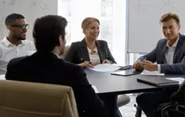 Managers Meeting around a Table